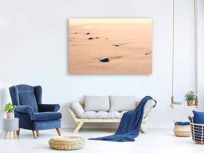Leinwandbild Kiesel im Sand
