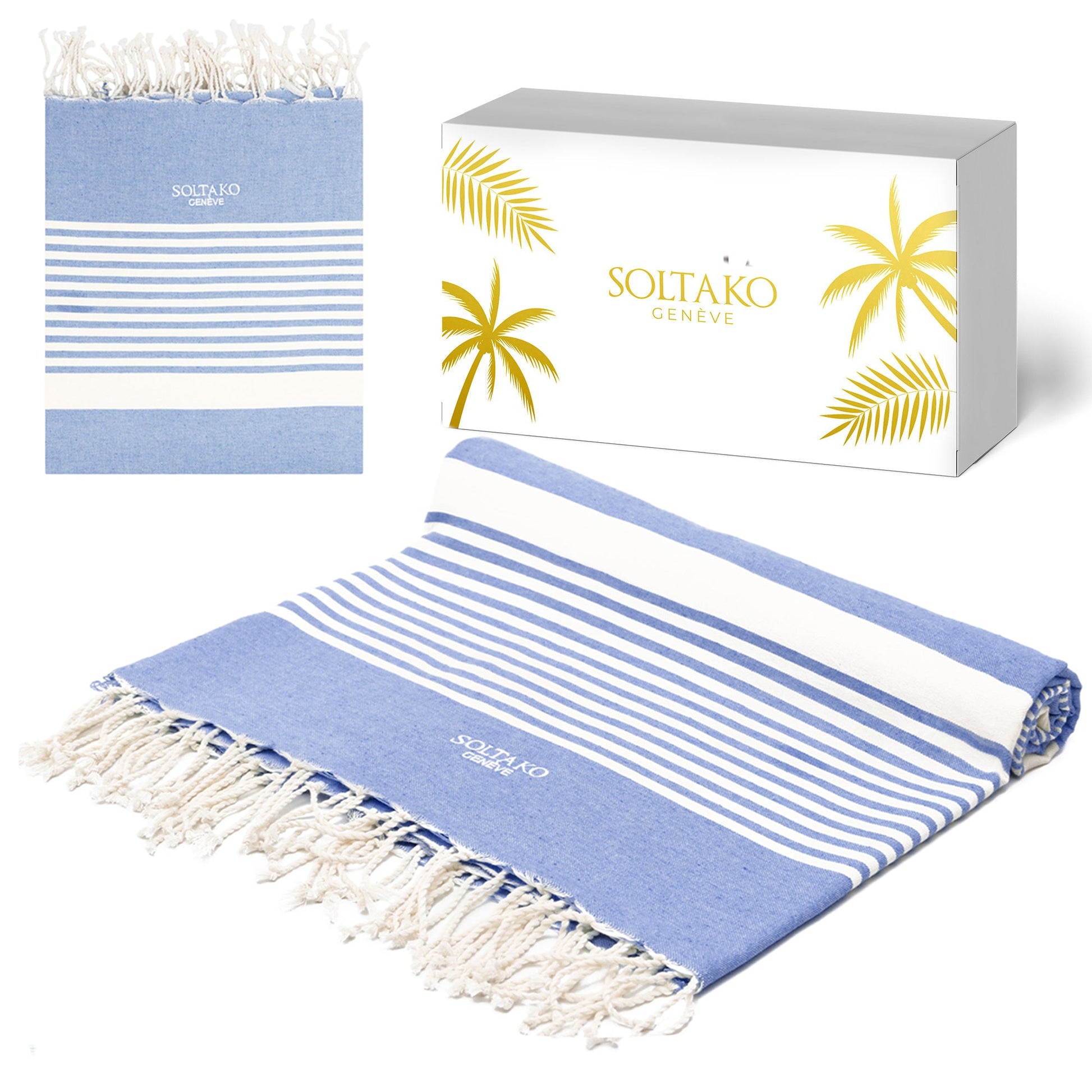 ein jeansblaues XXL Strandtuch fouta mit weiß-goldener Geschenkbox